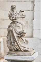 Statue of a gargoyle with an open mouth