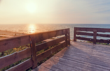 Fototapeta na wymiar Boardwalk with railings on the beach.