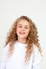 curly girl in white long sleeve t-shirt