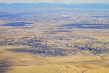 Aerial view of of farm in suburban of Denver in Colorado and the country road