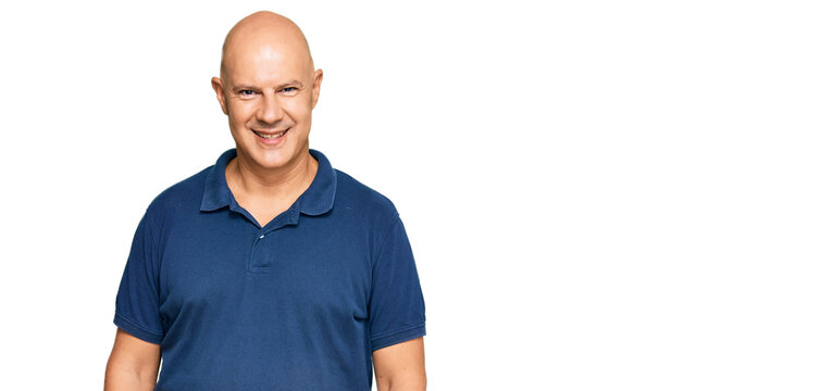 Middle age bald man wearing casual clothes with a happy and cool smile on face. lucky person.