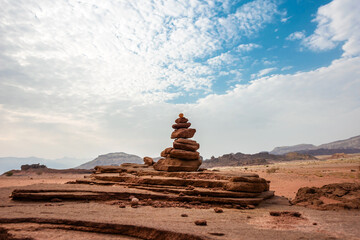 Stones balancing in the desert Timna against the sky. Stone stacking. Arava Valley, Israel. 