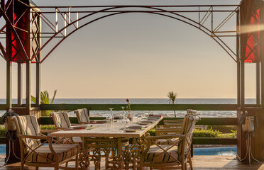 Served table in luxury restaurant with sea view.