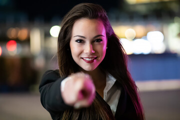 Young female manager pointing his finger to you, recruitment concept