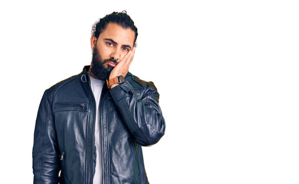 Young arab man wearing casual leather jacket thinking looking tired and bored with depression problems with crossed arms.