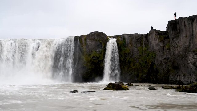 Powerful Godafoss Waterfalls on a cloudy day, Iceland. Slow motion