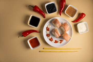 A set of sushi rolls is served on a light background. Japanese menu. Delicious traditional japanese food with sushi rolls.