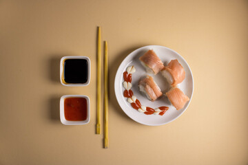 A set of sushi rolls is served on a light background. Japanese menu. Delicious traditional japanese food with sushi rolls.