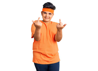 Little boy kid wearing sportswear showing middle finger doing fuck you bad expression, provocation...