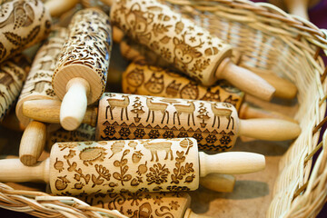 wooden carved rolling pin for cookies - obrazy, fototapety, plakaty