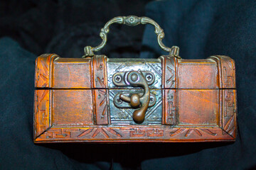  Old closed carved wooden jewelry box.