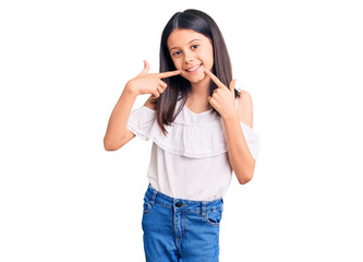 Beautiful child girl wearing casual clothes smiling cheerful showing and pointing with fingers teeth and mouth. dental health concept.