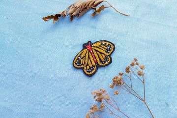 a butterfly made in beautiful hand embroidery made for a brooch or earrings or necklace