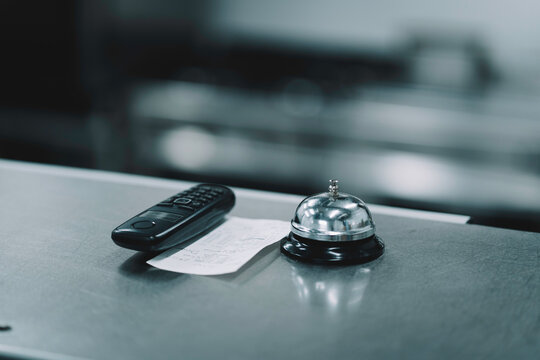 Wireless Phone, Kitchen Ticket And Order Bell On Stainless Steel Bench In Restaurant Kitchen.