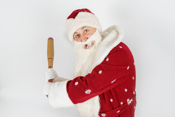 Santa Claus with a baseball bat in his hands. Isolated on white