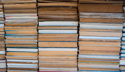 Background of all stacked books and sun light