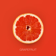 One juicy grapefruit half isolated over orange background, square shot