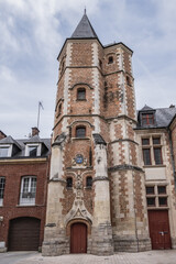 Beautiful architecture of ancient French buildings: Logis du Roi (from beginning of XVI century) - brick and stone building with tower, former hotel Trois-Cailloux. Amiens, Picardy, Somme, France.