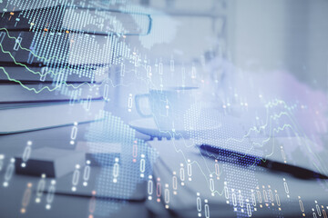 Double exposure of financial chart drawing and desktop with coffee and items on table background. Concept of forex market trading