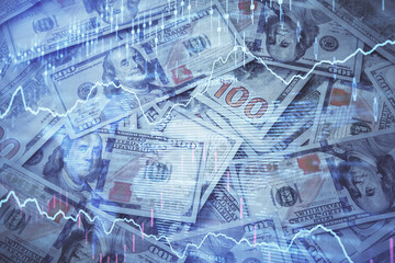 Fototapeta premium Double exposure of forex graph drawing over us dollars bill background. Concept of financial markets.