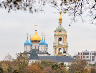 Blue and Golden domes and watchtower of the Novospassky monastery in autumn season in Moscow, Russia