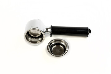 Black and silver coffee filter holder on its side with filter close by