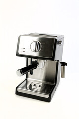 Black and silver espresso machine with filter holder and steaming wand at an angle over white