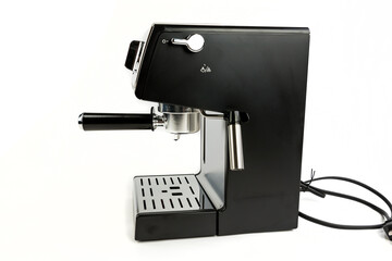 Black and silver espresso machine with cord coiled behind it side view with steaming wand to the back