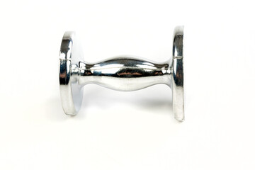 Silver coffee tamper laying down isolated on a white surface