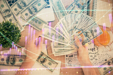 Multi exposure of financial graph drawing hologram and USA dollars bills and man hands. Analysis concept.