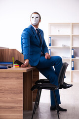 Young male employee wearing mask in the office