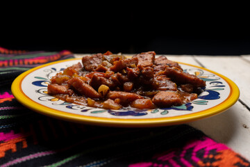 Pork chops with red sauce also called mexicana style on white background