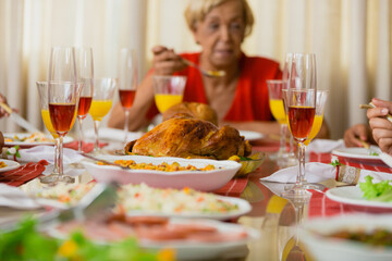 Summer Christmas dinner in Brazil. Real Brazilian family having fun at the Latin American Christmas party. delicious christmas turkey accompanied by potatoes