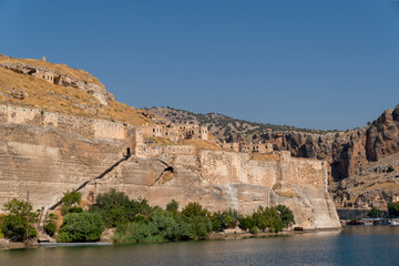 Fototapeta premium Abandoned stone houses on cliffs near the Euphrates River, Halfeti, Sanliurfa Province of Turkey