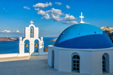Blue church dome and three bells
