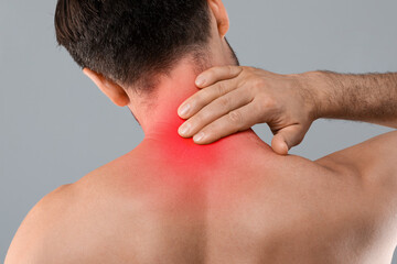 Closeup of man touching his inflammated neck