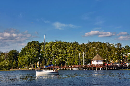 Yacht with tourists sailing in Lake Drwęca, Ostróda, Poland