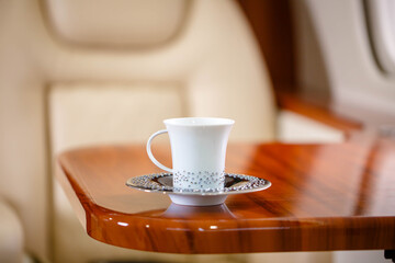 Cup of hot  tea served in business class