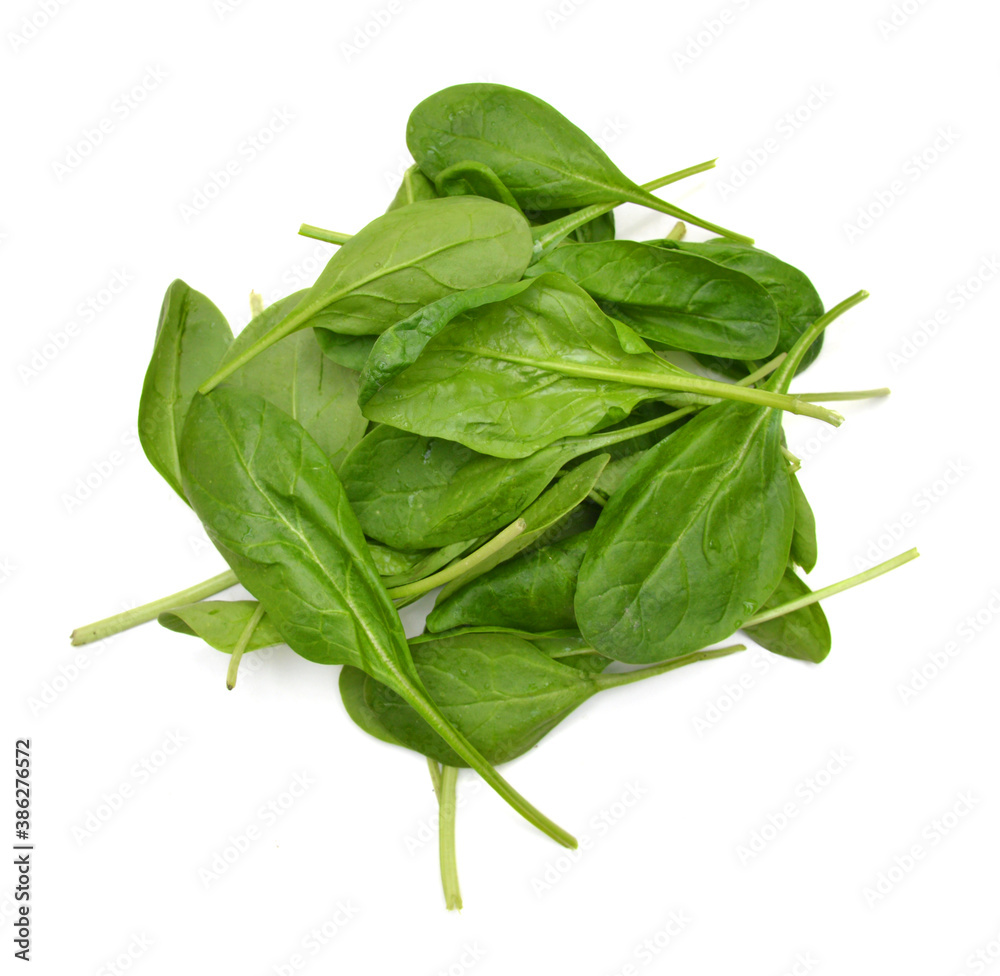 Wall mural Bunch of spinach leaves on isolated white background