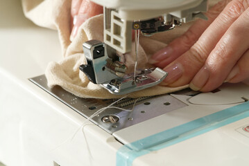 Sewing machine with focus on needle, shallow depth of field