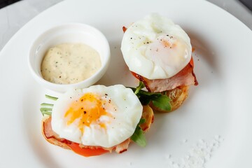 Bacon and eggs, with toasted croutons and strawberries. A delicious breakfast