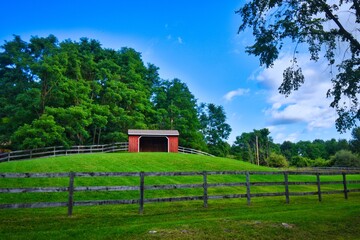 A barn on a field