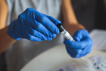 Process of coronavirus testing examination at home, COVID-19 swab collection kit, test tube for taking OP NP patient specimen sample, testing carried out, patient receiving a corona test