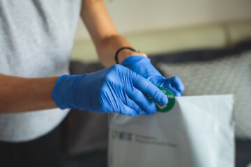 Process of coronavirus testing examination at home, COVID-19 swab collection kit, test tube for taking OP NP patient specimen sample, testing carried out, patient receiving a corona test