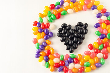 Black Jellybean Heart Inside a Colorful Jellybean Circle on a White Background