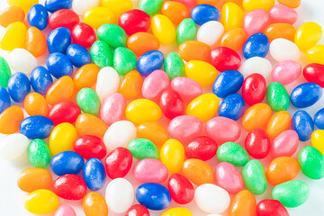 Fototapeta na wymiar Macro Shot of Colorful Jellybeans on a White Background