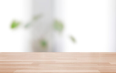 Empty wooden table and blurred modern indoor white kitchen coffee cafe background, restaurants. Ready for product montage display. template
