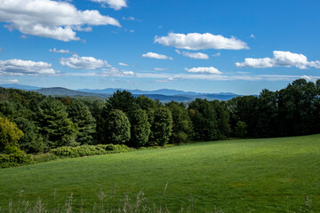Fototapeta na wymiar Mountains dot the horizon looking south from the center of Danville, Vermont