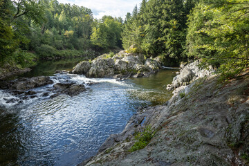 The Missisquoi River gathers in a natural pool above Big Falls