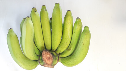 Bunch of green bananas, on a white